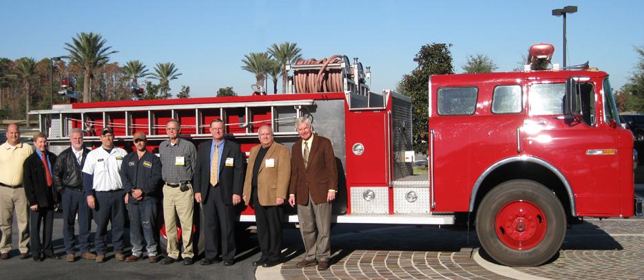 On hand to turn over the shiny, restored truck to Rodeheaver were several Ring Power employees and managers who took part in the effort. Pictured left to right: Branch Service Manager Chris Tomkinson, SVP Director of Facilities and Purchasing Dennis Steed, HE Unit Foreman Daryl Gandy, Larry Albane and Gerald Bustion; Rodeheaver representatives Jim Hughes, Jeff King and Ken Johnson; and President Randy Ringhaver.