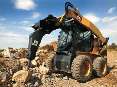 CAT Skidsteer with Hammer Attachment