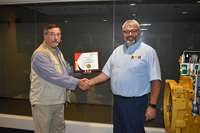 Clyde Rogers receives his certificate for IFPS from Gabe Sacco.