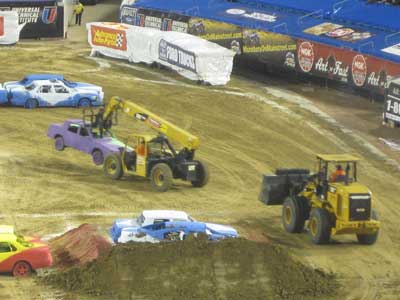 CAT Telehandler moves car during Monster Jam